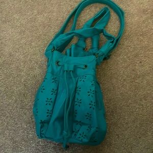 Beautiful turquoise handbag.